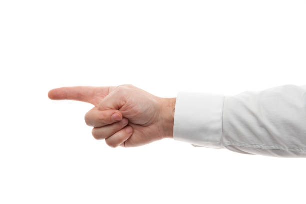 istock Man hands, pointing gesture isolated on white background. White shirt, business style. 1200513935