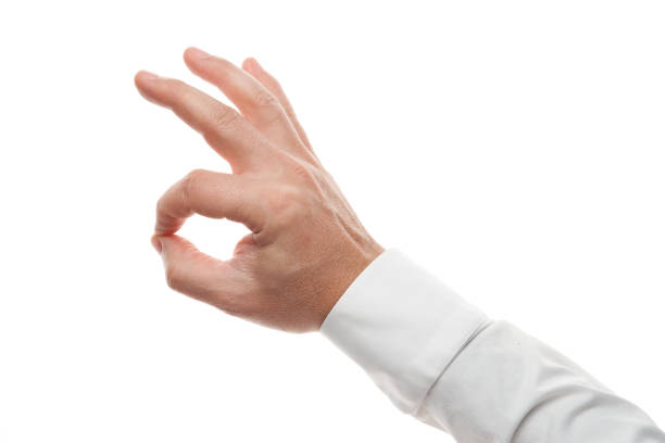 istock Man hands, okay gesture isolated on white background. White shirt, business style. 1200519211
