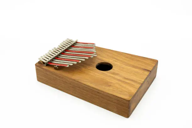 Details of a thumb piano (Kalimba, Mbira) with silver and red tines