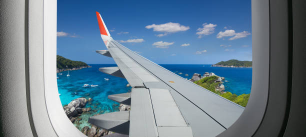 istock View from airplane. Flight window. Vacation destinations. Tropical beach.  Travel concept. 1200523500