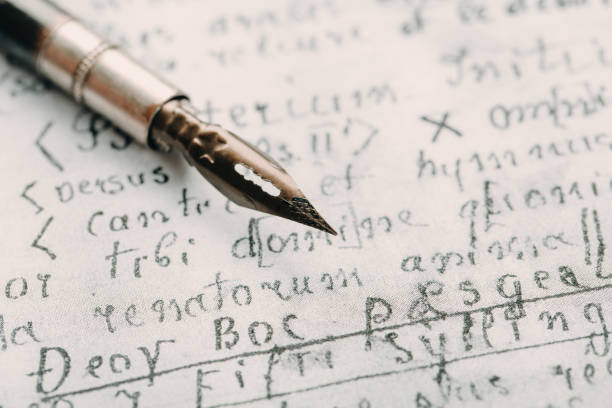 istock fountain pen on paper with ink text closeup 1200528320