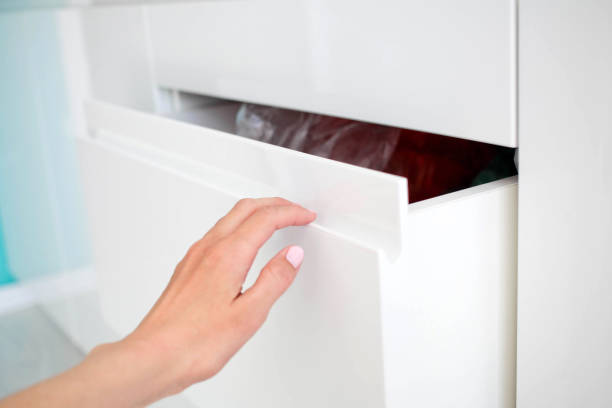 istock woman hand opens modern door white kitchen with the hidden handle 1200531453