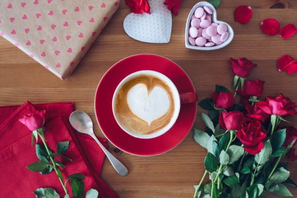 istock Valentine's Day flat lay: cup of coffee, gift box, and rose flowers 1200533582