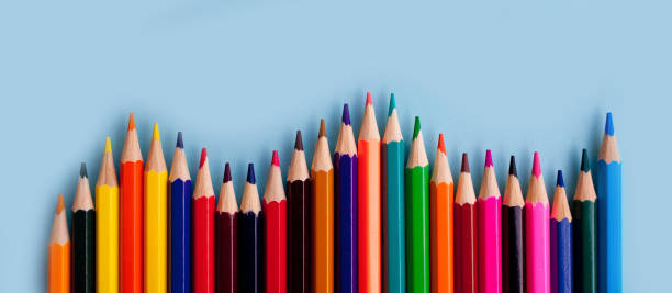istock color pencils on blue paper 1200535595