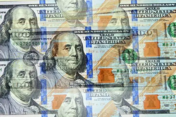 100 dollar bill in multiple background effect. Success concept
