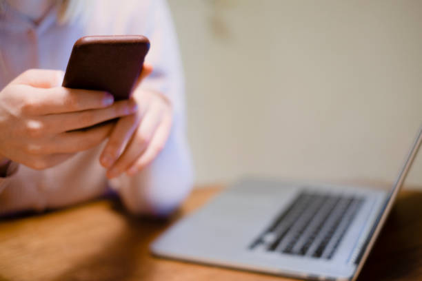 istock Woman having home office with phone and computer 1200537278