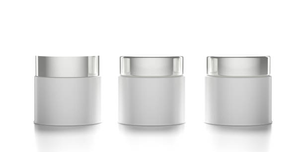 istock Glass cosmetic jars with covers isolated against white background. 3d illustration 1200539256