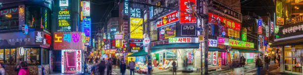 Vibrant neon lights illuminating the nightlife of Sinchon in Seoul, South Korea