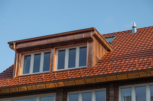 copper dormer on rooftop of apartment house