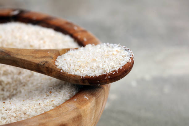 istock Portion of Psyllium Seeds on rustic dark background. Psyllium seed husks on wood 1200539849