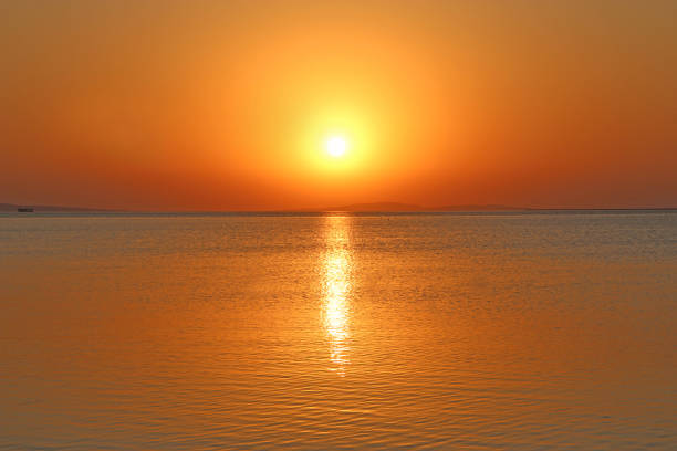 istock Dawn above sea. Beautiful summer decline above ocean 1200540474