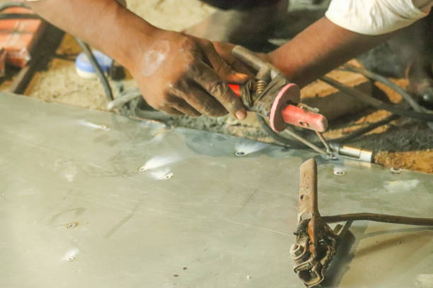 istock Indian Laborer Worker Hands Doing Metal Welding Of Aluminum With Tools 1200541620
