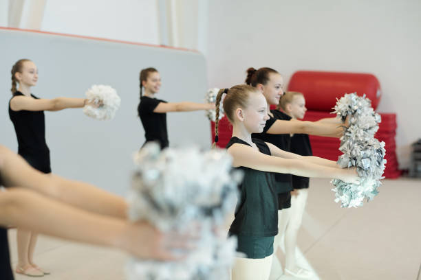 istock Cheerleading girls getting ready for competition 1200541970
