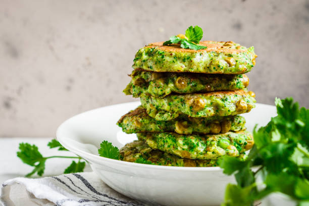 green broccoli and pea pancakes. healthy vegan food concept. - parsley cilantro leaf leaf vegetable imagens e fotografias de stock