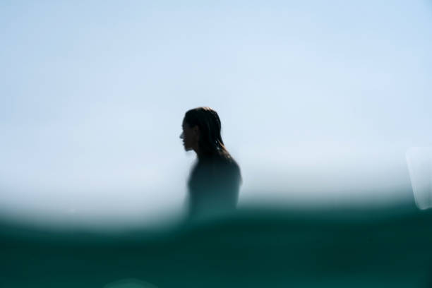 Silhouette surf girl defocused