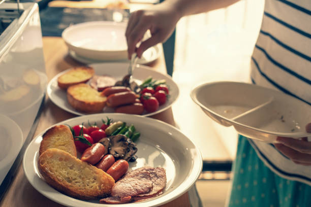 istock Selective focus of female cooking breakfast on kitchen counter bar 1200549117