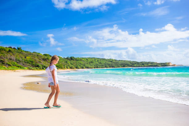 istock Happy kid looking at camera background beautiful sky and sea 1200552893