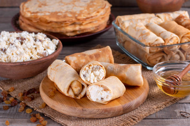 istock Thin pancakes stuffed with cottage cheese and raisins 1200552995