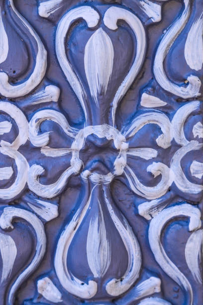 istock Swirly Floral Texture Pattern Design In Purple Grey White Carved On Wall Suitable For Background 1200553106