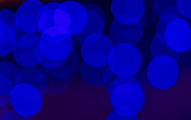 istock A blurred background with a group of blue circles from lighted lamps 1200554295
