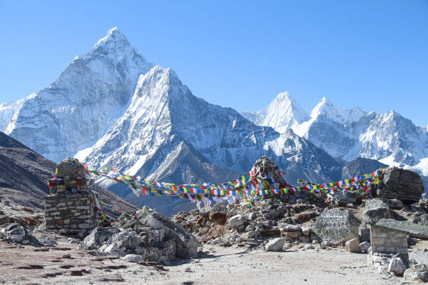 istock Ama Dablam mountain peak rises above trail to Everest Base Camp 1200559152