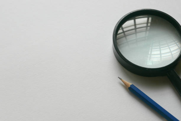 Magnifying glass on the blue background.
