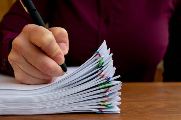 istock Employee making notes. Concept of a big amount of office work 1200560337