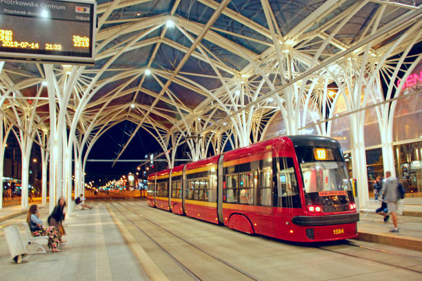 Lodz / Poland. 14 July 2019: City life in Lodz. Busy traffic on streets of Polish city of Lodz. night tramway riding around city. Modern tram going in evening city. Beautiful city panorama