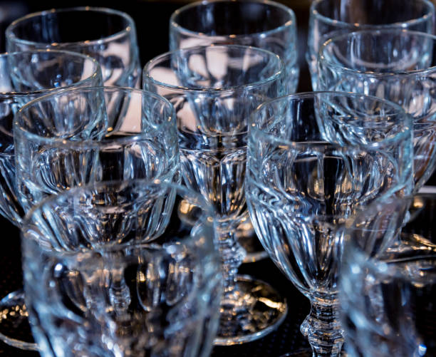 istock Wine and martini glasses in shelf above a bar rack in restaurant. 1200563762