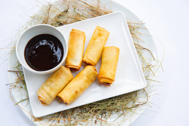 spring rolls with soy sauce stock photo