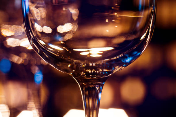 istock Wine and martini glasses in shelf above a bar rack in restaurant. 1200567961
