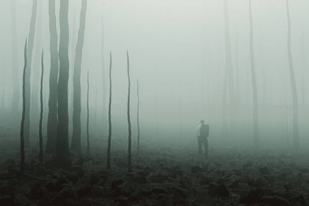 Sad businessman standing in destroyed environment