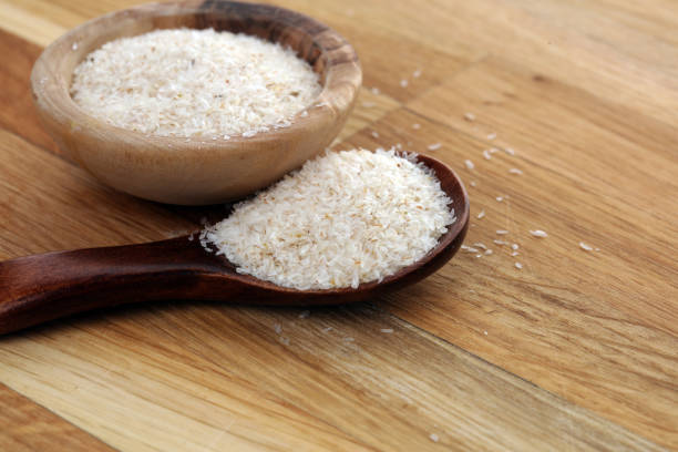 istock Portion of Psyllium Seeds on rustic dark background. Psyllium seed husks on wood 1200569691