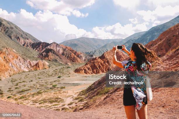 Tourist Woman Photographing The Mountains Of Argentina Stock Photo - Download Image Now