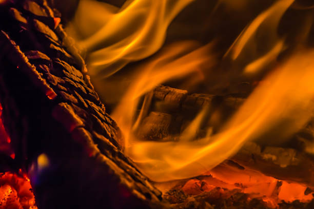 istock A beautiful horizontal texture of a burning fire on a black background with sparks 1200571104
