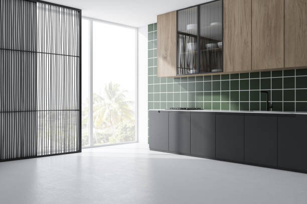 istock Green tile kitchen corner with gray countertops 1200571773