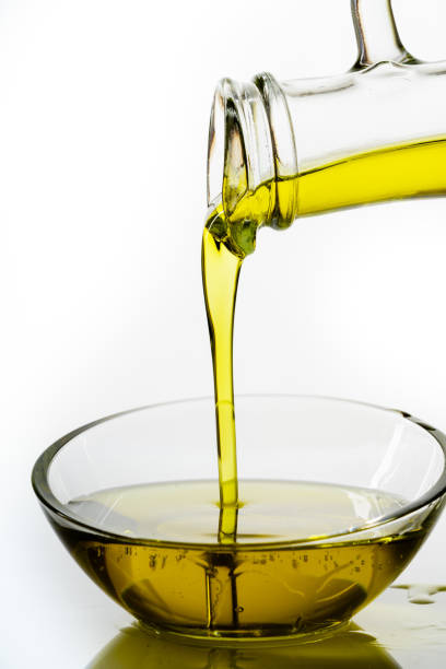 fresh and delicious olive oil, natural olive oil on white background - olive oil pouring antioxidant liquid imagens e fotografias de stock