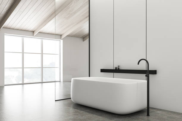 istock Attic white bathroom corner with tub 1200573787