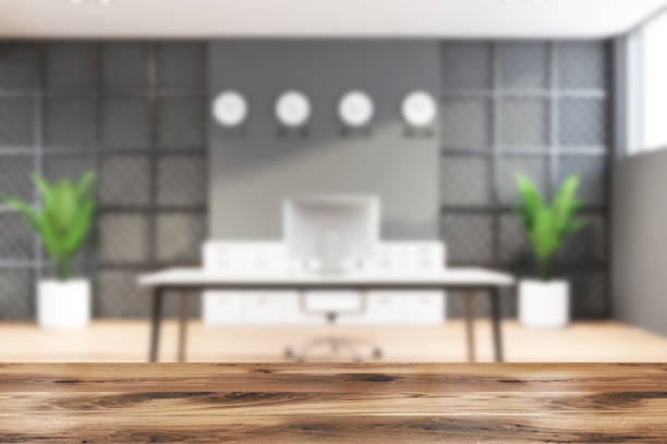 istock Blurry gray and metal CEO office with clocks 1200573978
