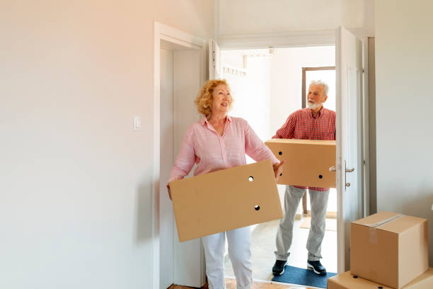 istock Senior couple moving into a new apartment 1200575494