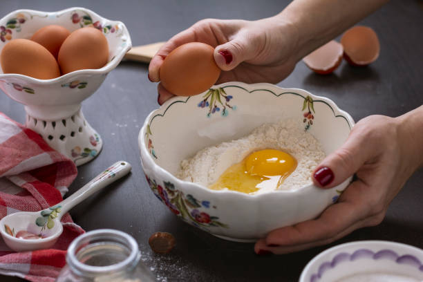 View from above female's hands kneading dough