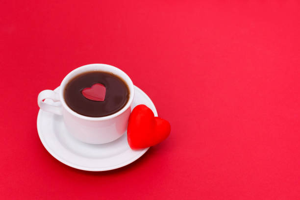 istock Valentines day background. Cup of coffe and heart shape on the table 1200577447