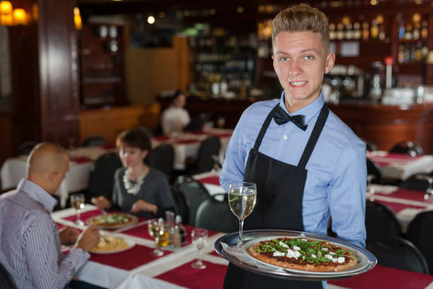 istock Waiter with tray in restaurant 1200577660