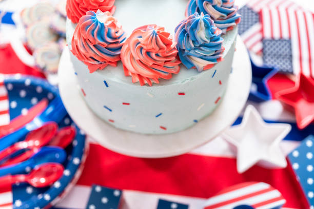 istock Cake, cookies, and fruit and vegetable snack tray at the July 4th celebration party. 1200577743