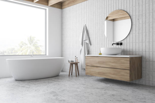 istock Loft white tile bathroom corner, tub and sink 1200577889