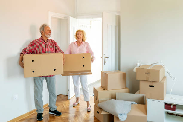 istock Senior couple moving into a new apartment 1200578819