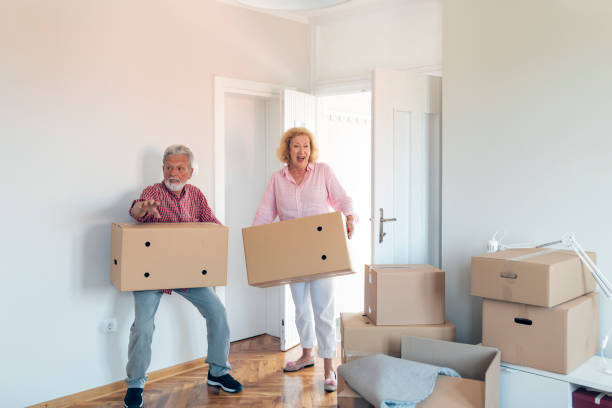 istock Senior couple moving into a new apartment 1200578887