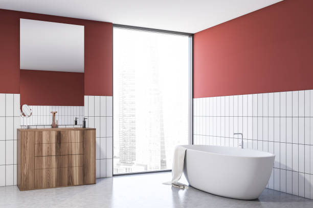 istock Red and white tile bathroom with tub and sink 1200580495