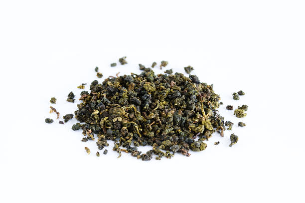 istock Tea in bulk with lotus flowers on a white background close-up 1200581393