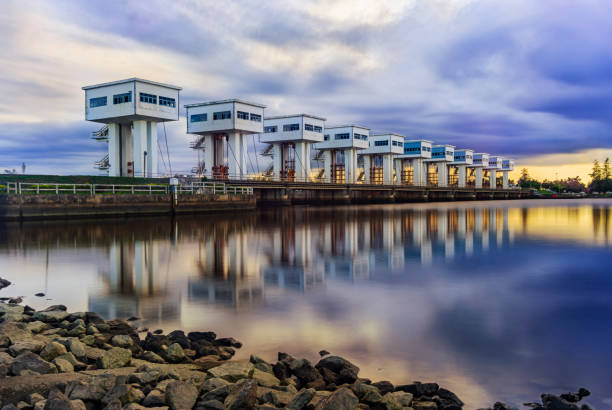 istock Water barrier with color of cloud sky and river 1200581921